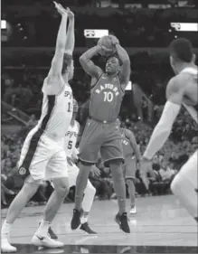  ?? ERIC GAY, THE ASSOCIATED PRESS ?? DeMar DeRozan (10) shoots over Spurs’ Pau Gasol in San Antonio on Monday night. The Raptors suffered their first loss of the season.