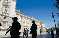  ?? Photo: AP ?? Police guard a palace where Nato heads will dine in Madrid.