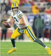  ?? Scott Strazzante/The Chronicle ?? Packers quarterbac­k Jordan Love scrambles against the 49ers on Saturday.