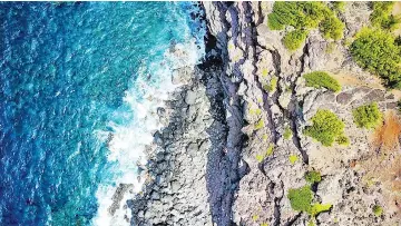  ??  ?? A drone image, shot off the coast of Maui, in Hawaii. The photograph­er has taken her DJI Mavic Pro through Europe, Asia and North America.