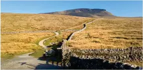  ?? ?? The Pennine Way and Wainwright’s Pennine Journey paths meet below Pen-y-ghent.