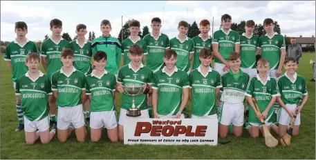  ??  ?? The victorious Cloughbawn squad with the spoils of victory.