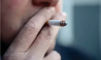  ?? Photograph: Jonathan Brady/PA ?? A man smoking a cigarette. Cancer Research UK says people in deprived communitie­s in England are two and a half times more likely to smoke.