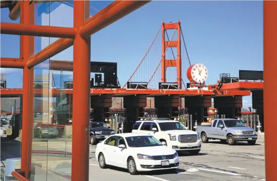  ?? Michael Macor / The Chronicle ?? Southbound vehicles pass through the toll plaza of the Golden Gate Bridge, which two-axle vehicles will pay an additional quarter to cross starting Monday.