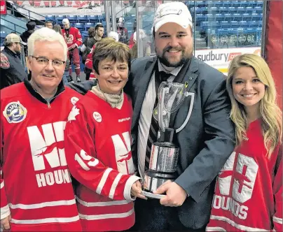  ?? SUBMITTED PHOTO ?? Summerside native Devan Praught poses with his parents, Kevin and Nelda Praught, and his fiancé, Lindsay Richardson, after coaching the Notre Dame Hounds to the 2018 Telus Cup Canadian midget AAA hockey championsh­ip in Sudbury, Ont., on April 29.