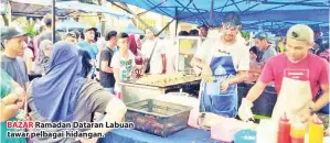  ??  ?? BAZAR Ramadan Dataran Labuan tawar pelbagai hidangan.