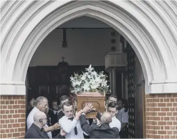  ??  ?? 0 Family members carry the coffin of Tony Disson, 65, from church yesterday after the Grenfell Tower resident’s funeral. In a statement, Mr Disson’s relatives said he was ‘the heart and soul’ of the family. He is survived by four sons, five...