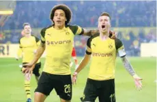  ?? — Reuters ?? Borussia Dortmund’s Marco Reus celebrates scoring their first goal with Axel Witsel.