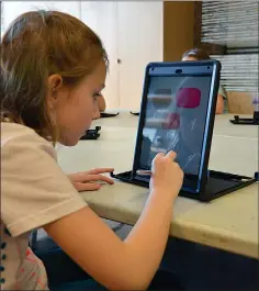  ?? SUBMITTED PHOTO ?? A student engages with an iPad during a program in the Esplanade Discovery Centre