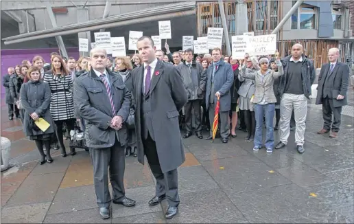  ?? Picture: Stewart Attwood ?? CHANGE OF STANCE: Law Society president Austin Lafferty, front left, pictured at a protest last year, says the latest package is fairer than earlier proposals.