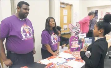  ?? STAFF PHOTO BY TIFFANY WATSON ?? On March 22, Chuck E. Cheese’s senior manager Alonzo Brewer and general manager April Dixon conduct a face to face interview with Nadia Corbett, 16, of Indian Head during the Young Adult Job Fair at Waldorf West Library.