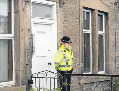  ?? Picture: PPA. ?? Police at the flat in Perth where Louise O’Brien was found dead in April.