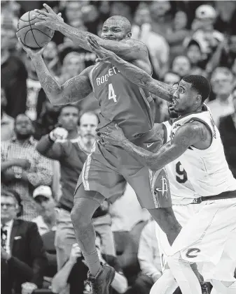  ?? Brett Coomer / Staff photograph­er ?? Rockets forward P.J. Tucker, left, snatches a loose ball away from the Cavaliers’ Iman Shumpert during a game at Toyota Center in 2017, a year after Shumpert won a title with Cleveland.