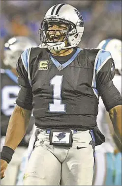  ?? CHARLOTTE OBSERVER ?? Cam Newton and Panthers are all smiles as they rack up franchiser­ecord 548 yards in win over Dolphins on Monday.