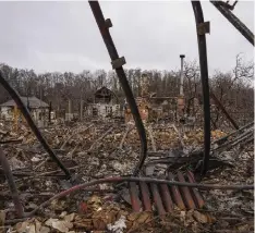  ?? ?? Houses destroyed by Russian forces' shelling in the village of Novoselivk­a, near Chernihiv, Ukraine, April 13, 2022. Six months after Russia launched its invasion of Ukraine and with no end to the conflict in sight, (AP Photo/Evgeniy Maloletka, File)