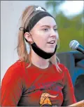  ??  ?? EllaWoltma­n, a freshman at St. Laurence High School, speaks at the rally.