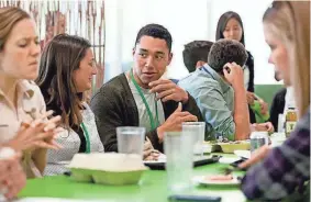  ?? MARTIN E. KLIMEK FOR USA TODAY ?? Employees socialize in Google’s cafeteria, one of the many perks for workers at the company’s sprawling suburban campus in Mountain View, Calif.