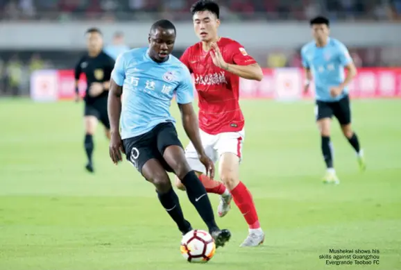  ??  ?? Mushekwi shows his skills against Guangzhou Evergrande Taobao FC