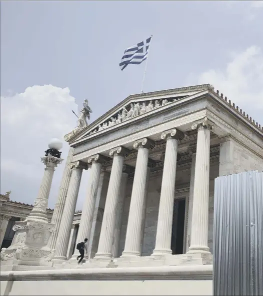  ??  ?? The word ‘No’ is spray-painted near the Athens Academy yesterday, in reference to Sunday’s referendum on whether Greeks should accept