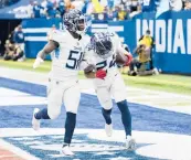  ?? AJ MAST/AP ?? Titans CB Elijah Molden (24) and LB David Long celebrate Molden’s intercepti­on return for a TD on Sunday.