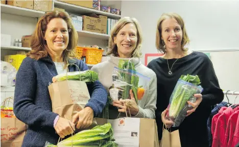  ?? GERRY BELLETT ?? Tracey MacKinlay, Pam Bragagnolo and principal Megan Davies pack food at Queen Alexandra’s Wishing Tree free food store.