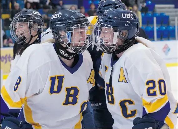  ?? RICHARD LAM/UBC ATHLETICS ?? Thunderbir­ds teammates Emily Grainger, left, and Christi Capozzi, right, celebrate during the club’s breakout 2012-13 Canada West season. Capozzi is back this season as captain and UBC is ranked No. 10 in the CIS heading into Friday’s home-opener.