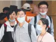  ?? Picture: TOBY ZERNA ?? ON ALERT: Passengers wear protective masks at Sydney airport.