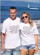  ?? Photo submitted by Chelsea Mereska ?? Southern Alberta residents Travis Vander Heyden and Chelsea Mereska are pictured Monday on a beach in Maui with their new souvenir T-shirts “Emergency alert ballistic missile threat inbound to Hawaii. Seek immediate shelter. Just kidding. Maui Hawaii.”