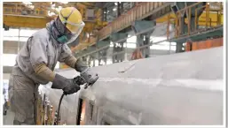  ?? VTEC. ?? An engineer carries out constructi­on work on the bodyshell of a Virgin Trains Class 800 Azuma in Kasado, Japan. The bodyshells, when complete, will be shipped to the UK and will undergo assembly at Newton Aycliffe, with the first arriving this summer.