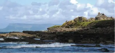  ??  ?? Various species of sea birds are found nesting in the surroundin­g cliffs around Aughris, while in the nearby deserted village ( above) you can find traces of primitive Booley huts. They consisted of dry stone walls with long scraws of sods thrown over...