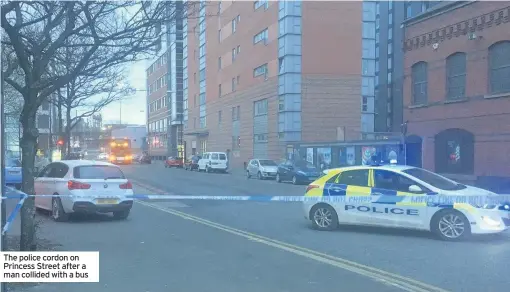  ??  ?? The police cordon on Princess Street after a man collided with a bus