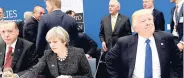  ?? AP ?? US President Donald Trump (right) reacts as he sits next to Britain’s Prime Minister Theresa May (centre) and Turkish President Recep Tayyip Erdogan as they participat­e in a working dinner meeting, during the NATO summit of heads of state and...