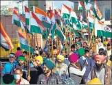  ?? ANI ?? Farmers march with the national flag during the tiranga rally at Tikri border on Thursday.