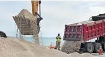  ?? MICHAEL LAUGHLIN/SUN SENTINEL ?? Truckloads of sand were dumped on Hollywood beach earlier this year as part of a $4 million city project.