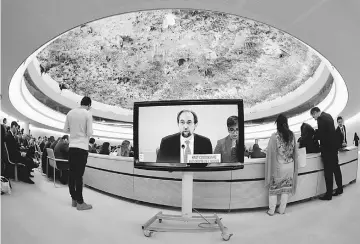  ??  ?? Zeid is pictured on a screen during his speech at the 36th Session of the Human Rights Council at the United Nations in Geneva. — Reuters photo