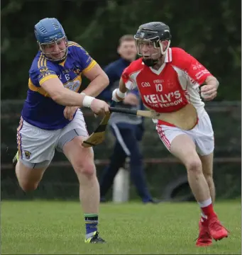  ??  ?? David Murphy of St. Mary’s (Rosslare) makes a tackle on Monageer-Boolavogue’s Mark Walsh in their Group B clash in Hollymount on Saturday.