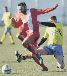  ??  ?? Hylton CW (red) attack against Ryhope Foresters Over-40s.