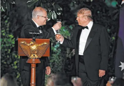  ?? Alex Brandon The Associated Press ?? President Donald Trump and Australian Prime Minister Scott Morrison toast Friday during a state dinner at the White House.