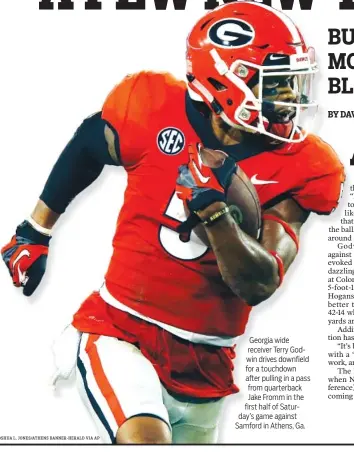  ?? JOSHUA L. JONES/ATHENS BANNER-HERALD VIA AP ?? Georgia wide receiver Terry Godwin drives downfield for a touchdown after pulling in a pass from quarterbac­k Jake Fromm in the first half of Saturday’s game against Samford in Athens, Ga.