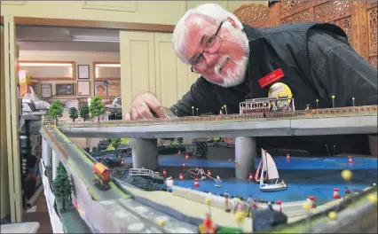  ??  ?? LIGHTS AND WHISTLES: Grampians Model Railroader­s’ treasurer Clyde Humphries with his layout for display at Ararat Model Train Show this weekend. Picture: PAUL CARRACHER