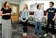  ?? Janelle Jessen/Siloam Sunday ?? Teacher Megan Dennison introduced Esther Gowin, Jonah Jackson and Luke Nast, members of the high school’s District Report news crew, during the school board meeting on Thursday night. Throughout the school year, the students have produced a monthly...