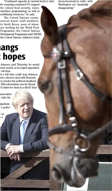  ?? AFP ?? BRITAIN’S Prime Minister Boris Johnson watches a horse exercise during a visit with the police in Wakefield, West Yorkshire, northern England on Thursday.