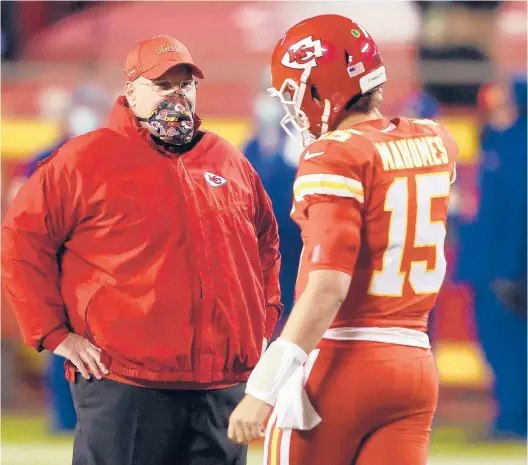 ?? JAMIE SQUIRE/GETTY ?? Chiefs quarterbac­k Patrick Mahomes, right, speaks with coach Andy before game against the Broncos on Dec. 6.