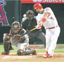  ?? AP ?? ↑ Albert Pujols sigue subiendo escalones ofensivos de por vida.