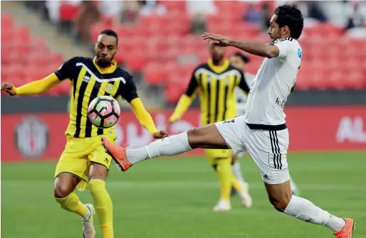  ?? Photo by Ryan Lim ?? Al Jazira’s Ali Mabkhout vies for the ball against Ghanem Ahmed during their Arabian Gulf League match held at Mohamed bin Zayed Stadium on Friday. —