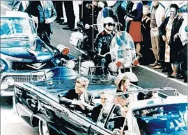  ?? Universal History Archive ?? PRESIDENT KENNEDY and First Lady Jacqueline Kennedy ride through the streets of Dallas in the presidenti­al limousine before his assassinat­ion in 1963.