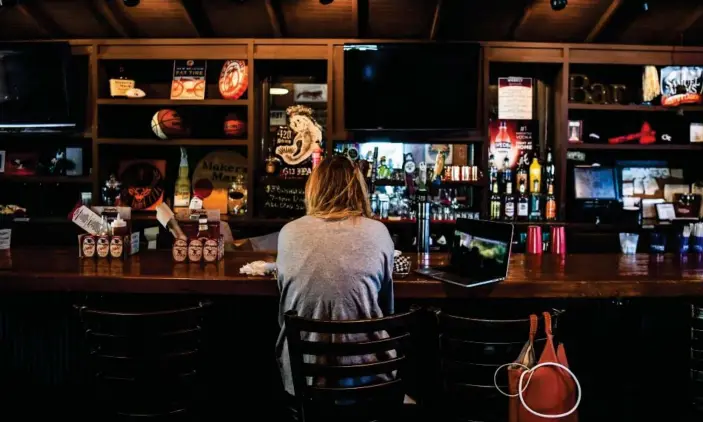  ?? Photograph: Chandan Khanna/AFP via Getty Images ?? A customer sits at the bar in a restaurant in Atlanta, Georgia, on 27 April.