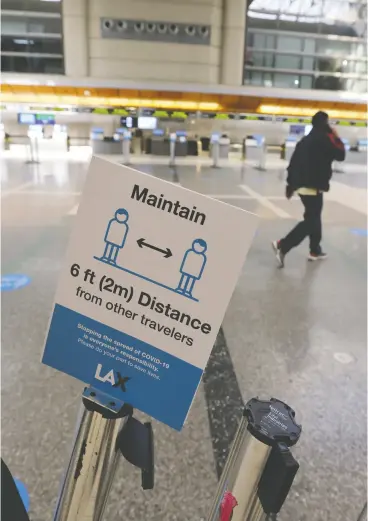  ?? Lucy Nicholson / reuters ?? A man walks through the airport in Los Angeles on Monday in a year that the history books will record “as the industry’s worst financial year, bar none,”
according to IATA chief executive Alexandre de Juniac.