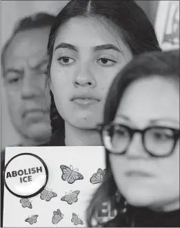  ?? [AMR ALFIKY/THE ASSOCIATED PRESS] ?? A demonstrat­or holds a sign opposing the expected immigratio­n raids during a new conference Thursday outside the U.S. Immigratio­n and Customs Enforcemen­t offices in Chicago.