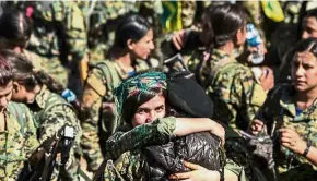  ??  ?? Well-earned victory: Female SDF fighters celebratin­g the retaking of Raqqa at the Al-Naim square. — AFP